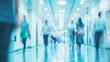 © Taras Vykhopen - Urgent activity in a busy hospital hallway with medical staff and patients in soft focus