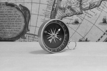 Wall Mural - classic round compass on background of old vintage map of world