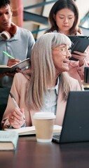 Leinwandbilder - Education, teacher or writing in college with students, discussion or assessment requirements at tech. Mature lecturer, people or notes in university for feedback, growth or explain for understanding