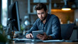 © THANAT SAINAK - Young businessman sitting and working
