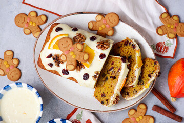 Wall Mural - Pumpkin Christmas cake with dried fruits, spices and cheese frosting on a Christmas rustic background