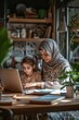 © Oscar - A Muslim woman in a hijab helping her daughter with homework at the kitchen table, both focused on the work,