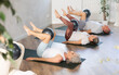 © JackF - Group of elderly people in sportswear practice pilates with soft ball on mat in fitness studio