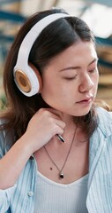 Poster - Thinking, headphones and books with Asian woman in cafeteria for studying, writing and college. University, learning and education with person listening to podcast for knowledge, future and research