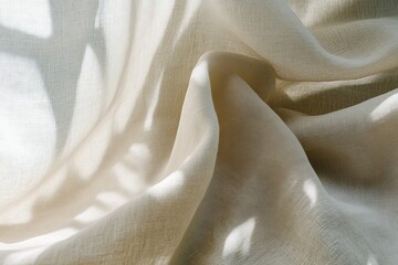Poster - The image displays a flowing beige fabric with soft shadows cast by dappled sunlight, creating a sense of warmth and tranquility, ideal for a cozy setting.