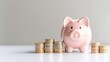 © AiAbstract - Cute Pink Piggy Bank with Coins on Clean Surface