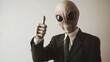 © XtzStudio - Alien in Suit Giving Thumbs Up
