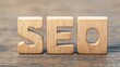 © nongnuch - The image features wooden letters spelling 'SEO' against a natural wood background, symbolizing search engine optimization concepts.