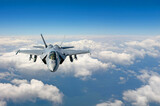 Fighter plane in flight, military aircraft, army plane flying in the sky with clouds, front top view,