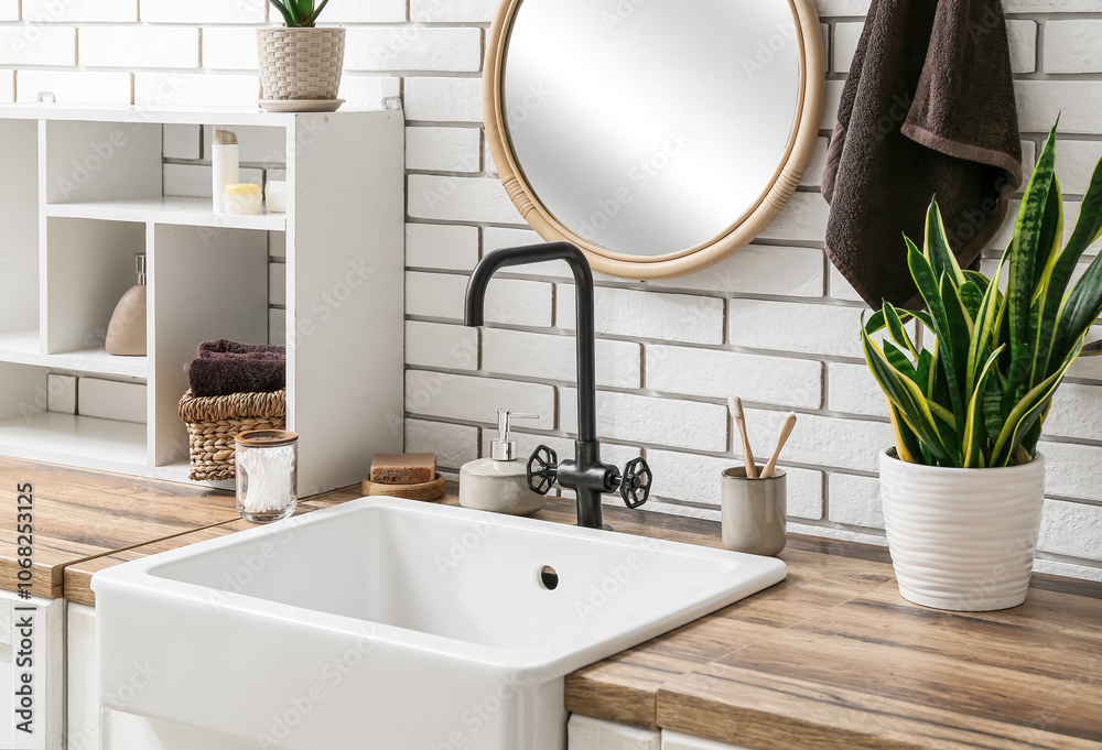 Bath supplies, shelf and sink on table in bathroom