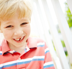 Child, boy and portrait with teeth in garden for dental milestone, oral development and happy with mouth. Health, kid and pride for growth, childhood memory and missing tooth with wellness by house