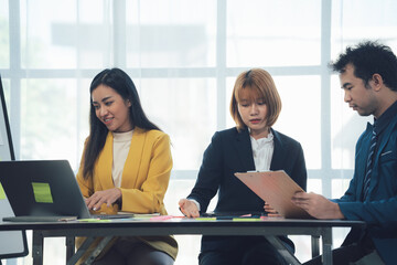 Wall Mural - Collaborative Business Meeting: A diverse team of professionals engages in a productive meeting, showcasing teamwork and strategic planning.  