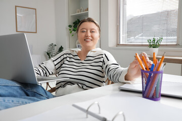 Poster - Beautiful young happy woman laptop working at home. Remote work concept