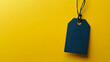 © Hryhor Denys - A blank black price tag hangs against a bright yellow background, symbolizing the excitement of Black Friday sales and shopping for bargains