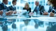 © Ponchita - Business Meeting Table with Papers and Documents in Focus, Out of Focus Business People in Background