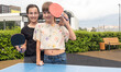 © Angelov - Cute girl playing ping-pong outdoors