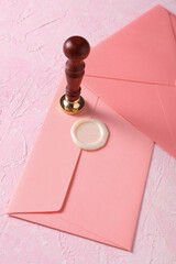 Sticker - Envelopes with wax seal and vintage stamp on pink concrete background. Gift certificate, wedding invitation