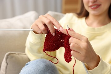 Wall Mural - Woman knitting with needles at home, closeup