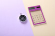 © splitov27 - Calculator with compass on a pastel background. Business concept
