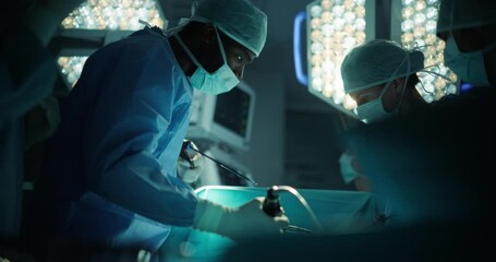 Poster - Portrait of a Young African Surgeon at Work, Performing a Surgical Procedure with a Team of Doctors. Clinical Staff in Face Masks and Protective Outfits Saving Life of a Patient