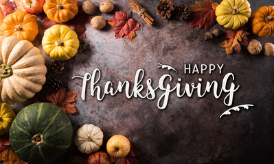 Wall Mural - thanksgiving background concept with fall leaves, pumpkin and seasonal autumnal decor and the text o