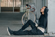 © carballo - young man relax on street with bicycle