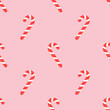 © Nadia - Cute Christmas seamless pattern with candy canes. Flat pink background design. Repeating print for fabric, wrapping paper, textile, wallpaper