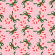 © Nadia - Seamless pattern with Christmas candy canes and bows on pink background. Cute background design for fabric, wrapping paper, textile, wallpaper