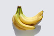 © Tetra Images - Bunch of bananas on white background