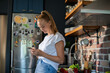 © Geber86 - Young woman cooking healthy vegetables in modern kitchen