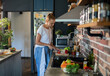© Geber86 - Young woman cooking healthy vegetables in modern kitchen