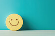 © PhotoGranary - Minimalist wooden smiley face icon against a turquoise background, symbolizing positivity and simplicity. Ideal for cheerful and uplifting themes.