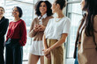 © Jacob Lund - Group of businesswomen conversing during a conference at the office