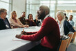 © Jacob Lund - Confident businessman listening attentively in a meeting with colleagues