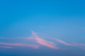 Wall Mural - blue sky with light pink clouds. abstract texture background.