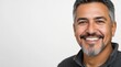 © David Zarzosa - A portrait of a mature man with a warm smile, looking confidently at the camera on white background with copy space.