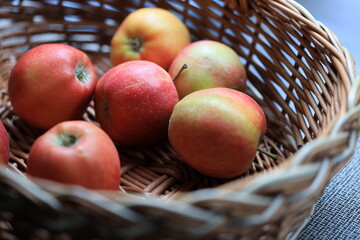 Poster - A colorful basket filled with many red and green apples.