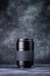 © Mandeep - Close-up of a professional camera lens on a dark background