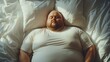 © garpinina - Overweight man sleeping peacefully in bed hugging soft white pillow