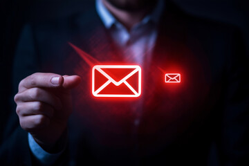 Poster - man is holding a red envelope in his hand. The envelope is glowing red and is surrounded by a glowing red background. Concept of urgency and importance