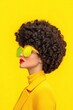 © Mandeep - Vibrant and stylish woman with curly hair and bold sunglasses