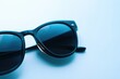 © Vii - A pair of sunglasses resting on a surface, ready for use