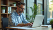 © mattegg - Focused Business Professional Working on Laptop
