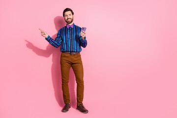 Poster - Full length photo of groomed cheerfu lhusband man wear stylish striped clothes empty space isolated on pink color background