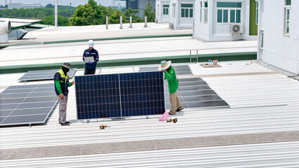 Wall Mural - a team of technicians inspects solar panels on metal rooftop, equipped with tools, laptops, and safe