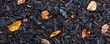 © cac_tus - Autumn leaves on dark wood chips surface, top view. Nature texture and seasonal concept
