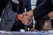 © David - Business handshake for teamwork of business merger and acquisition,successful negotiate,hand shake,two businessman shake hand with partner to celebration partnership and business deal concept