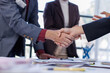 © David - Business handshake for teamwork of business merger and acquisition,successful negotiate,hand shake,two businessman shake hand with partner to celebration partnership and business deal concept