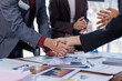 © David - Business handshake for teamwork of business merger and acquisition,successful negotiate,hand shake,two businessman shake hand with partner to celebration partnership and business deal concept