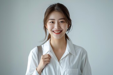 Wall Mural - Young Asian businesswoman confidently walks to office with smile.